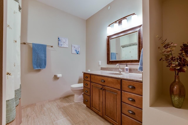 392 Campbell Hill Ct, Deforest, WI 53532 - bathroom featuring vanity, toilet, and baseboards