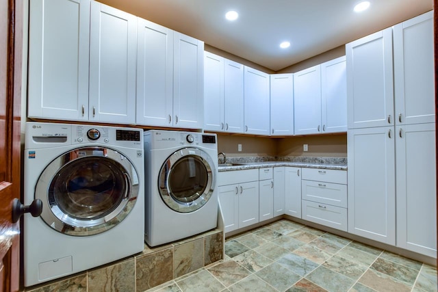 392 Campbell Hill Ct, Deforest, WI 53532 - washroom featuring cabinet space, washer and clothes dryer, light stone finish floors, and recessed lighting