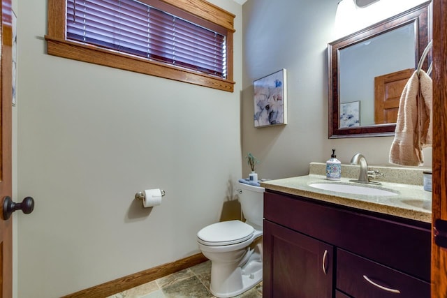 392 Campbell Hill Ct, Deforest, WI 53532 - half bathroom with toilet, baseboards, and vanity