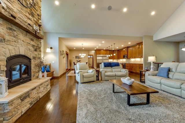 392 Campbell Hill Ct, Deforest, WI 53532 - living room featuring dark wood finished floors, a chandelier, recessed lighting, a fireplace, and baseboards
