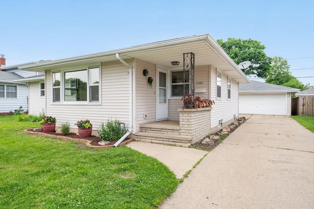 1500 E Lindbergh St, Appleton, WI 54911 - view of front of property with a front yard, an outbuilding, a garage, and covered porch