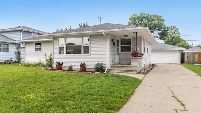 1500 E Lindbergh St, Appleton, WI 54911 - bungalow-style house featuring a front yard, a garage, an outbuilding, and roof with shingles