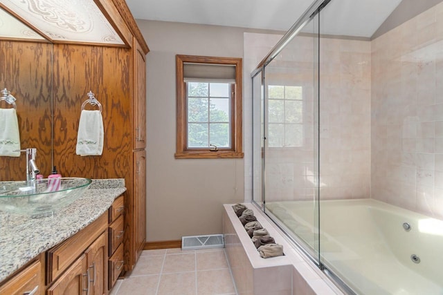 3544 Windsong Ter, Oshkosh, WI 54904 - bathroom featuring a whirlpool tub, tile patterned floors, a tile shower, and baseboards