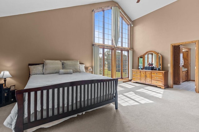 3544 Windsong Ter, Oshkosh, WI 54904 - bedroom featuring carpet floors, high vaulted ceiling, ensuite bath, and a ceiling fan