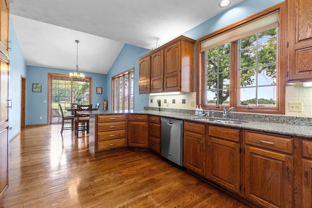 3544 Windsong Ter, Oshkosh, WI 54904 - kitchen with dishwasher, a sink, lofted ceiling, dark wood-type flooring, and decorative backsplash