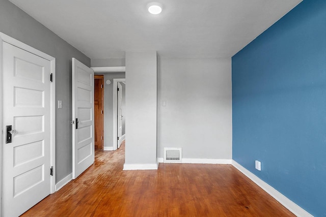 1212 N Leminwah St, Appleton, WI 54911 - empty room featuring baseboards and wood finished floors