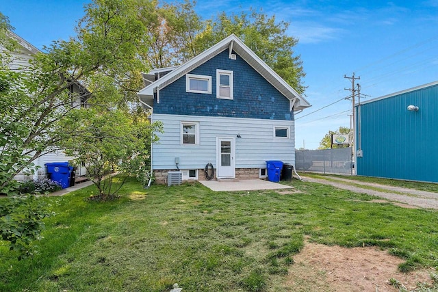 1212 N Leminwah St, Appleton, WI 54911 - back of property featuring a patio area and central AC