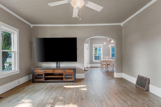 1212 N Leminwah St, Appleton, WI 54911 - living room with arched walkways, wood finished floors, ornamental molding, baseboards, and ceiling fan
