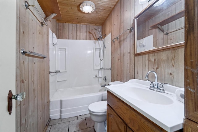 N7618 County Road C, Eldorado, WI 54932 - full bath featuring wood walls, toilet, vanity, washtub / shower combination, and tile patterned floors