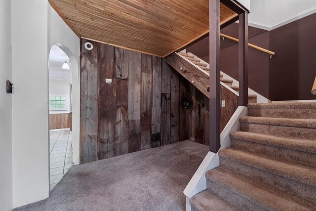 N7618 County Road C, Eldorado, WI 54932 - stairs featuring wood ceiling, carpet floors, arched walkways, and wood walls