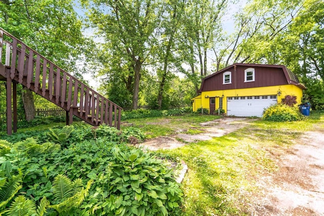 N7618 County Road C, Eldorado, WI 54932 - view of yard featuring a garage and stairs