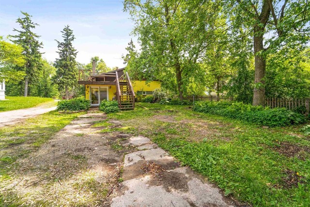 N7618 County Road C, Eldorado, WI 54932 - view of yard with stairway and a wooden deck