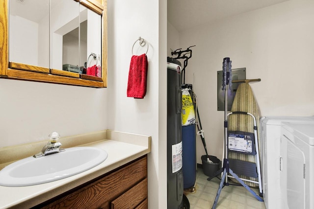 2020 Meadow Ct Unit 2, West Bend, WI 53095 - bathroom with washer / clothes dryer, tile patterned floors, and vanity