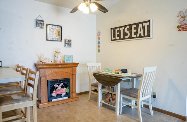 2020 Meadow Ct Unit 2, West Bend, WI 53095 - dining room featuring a ceiling fan, baseboards, and tile patterned flooring