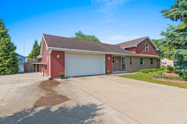 1283 Sundown Ln, De Pere, WI 54115 - view of front of property featuring a garage and concrete driveway