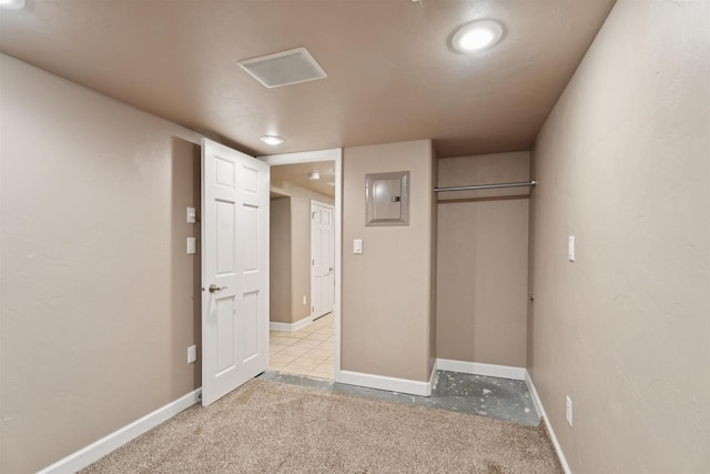 476 Taft St, Fond Du Lac, WI 54935 - unfurnished bedroom with electric panel, a closet, baseboards, and light carpet