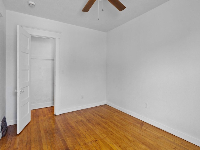 2544 N 35th St Unit 2546, Milwaukee, WI 53210 - unfurnished bedroom with baseboards, hardwood / wood-style flooring, ceiling fan, and a closet