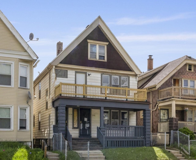 2544 N 35th St Unit 2546, Milwaukee, WI 53210 - view of front of house featuring a porch, a balcony, and a chimney
