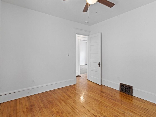 2544 N 35th St Unit 2546, Milwaukee, WI 53210 - empty room with ceiling fan, light wood-type flooring, and baseboards