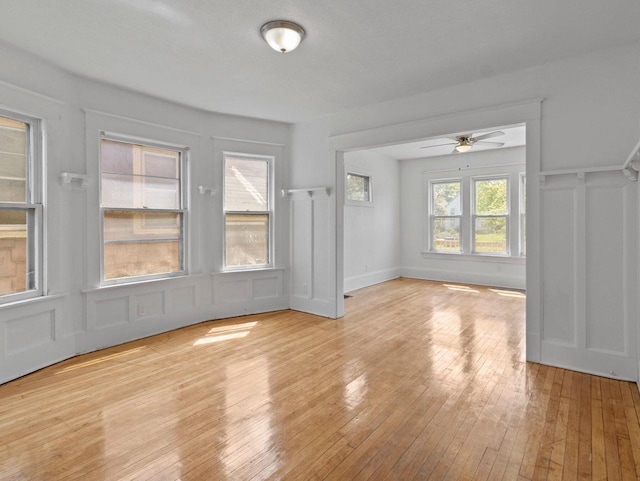 2544 N 35th St Unit 2546, Milwaukee, WI 53210 - unfurnished dining area with wood-type flooring, a decorative wall, and ceiling fan