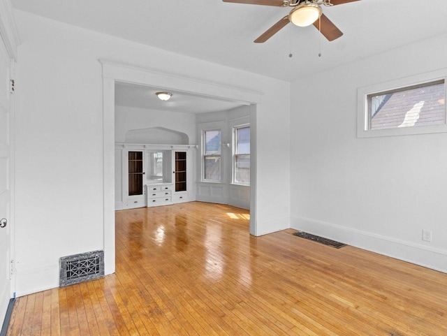 2544 N 35th St Unit 2546, Milwaukee, WI 53210 - unfurnished living room featuring a ceiling fan, light wood-style flooring, and baseboards