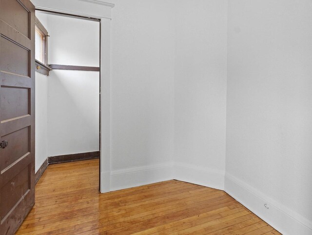 2544 N 35th St Unit 2546, Milwaukee, WI 53210 - unfurnished bedroom featuring light wood-style flooring and baseboards