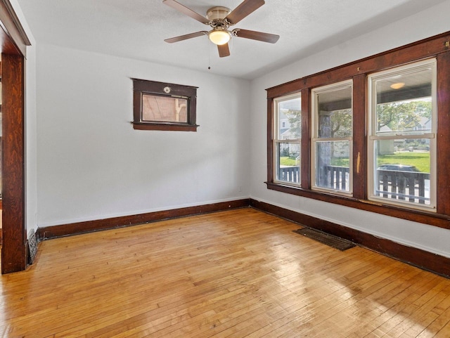 2544 N 35th St Unit 2546, Milwaukee, WI 53210 - spare room with baseboards, plenty of natural light, and light wood-style flooring