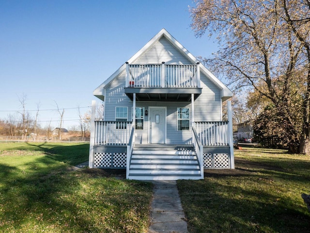 8428 Fox River Rd, Waterford, WI 53185 - view of front facade with a balcony and a front yard
