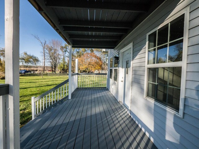 8428 Fox River Rd, Waterford, WI 53185 - wooden porch featuring a yard