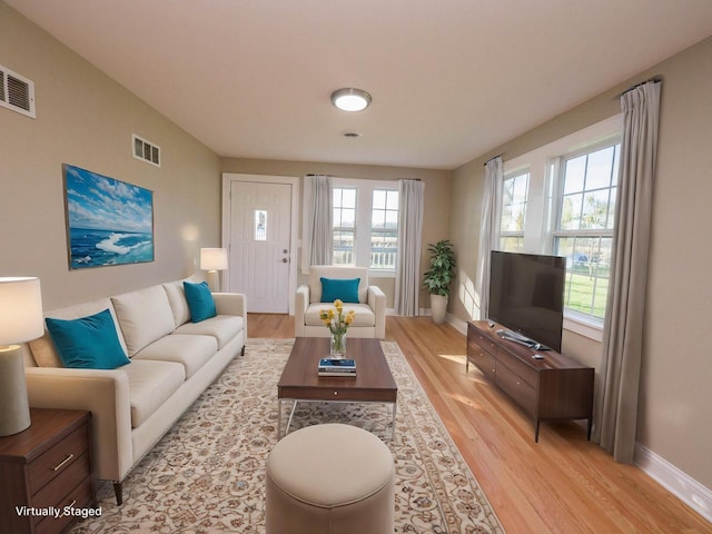 8428 Fox River Rd, Waterford, WI 53185 - living area featuring light wood-style flooring, plenty of natural light, and baseboards