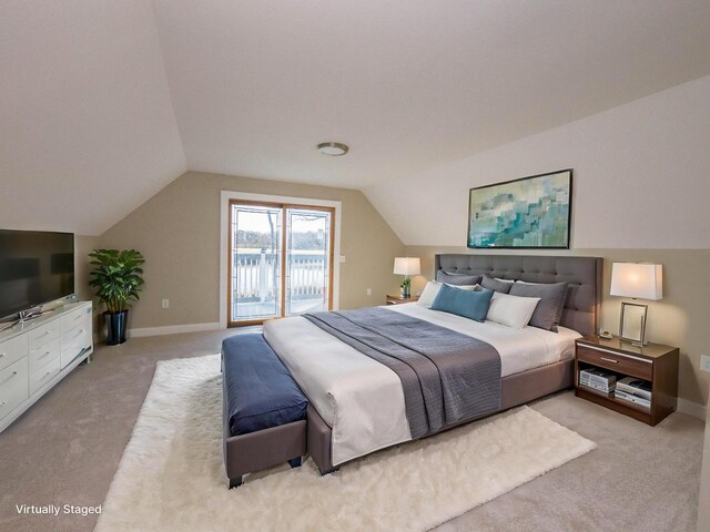 8428 Fox River Rd, Waterford, WI 53185 - bedroom with access to exterior, light colored carpet, lofted ceiling, and baseboards