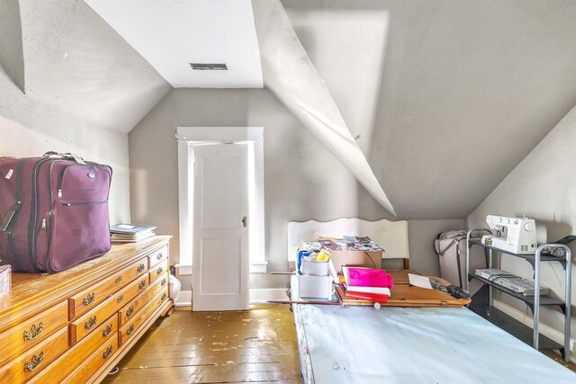 823 N Main St, Marion, WI 54950 - bedroom featuring vaulted ceiling and hardwood / wood-style floors