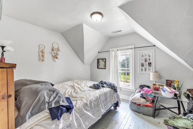 823 N Main St, Marion, WI 54950 - bedroom featuring hardwood / wood-style flooring and lofted ceiling