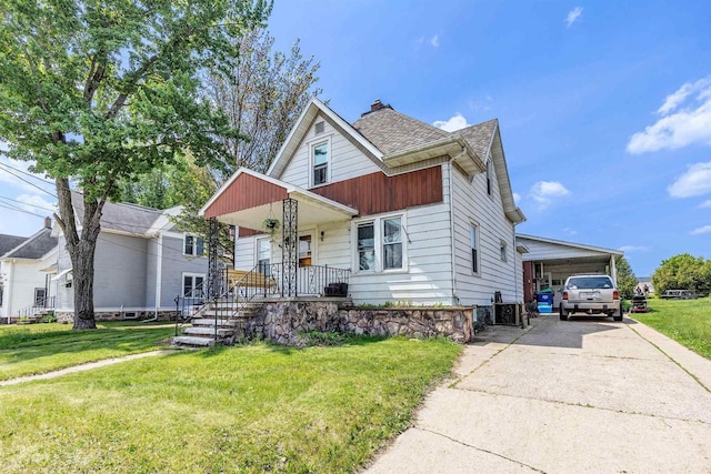823 N Main St, Marion, WI 54950 - view of front of house featuring a front lawn, a porch, driveway, and a chimney