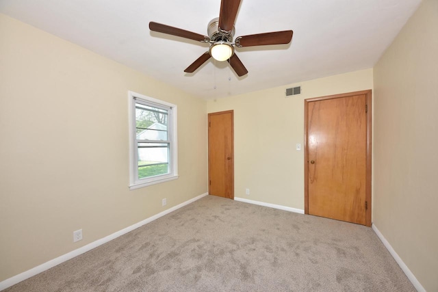 3825 S 5th St Unit 3823, Milwaukee, WI 53207 - unfurnished bedroom with carpet floors, baseboards, and ceiling fan