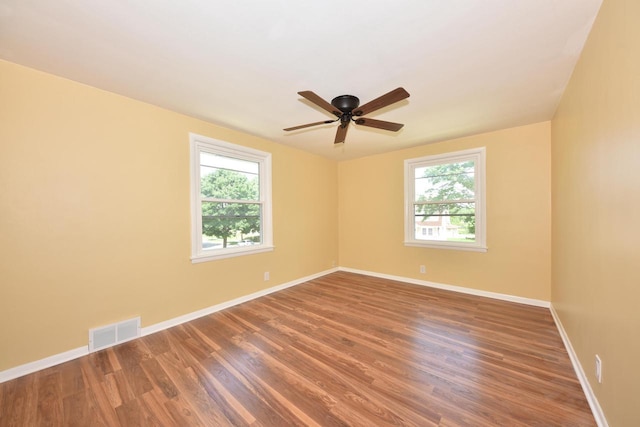 3825 S 5th St Unit 3823, Milwaukee, WI 53207 - empty room with plenty of natural light, wood finished floors, and a ceiling fan