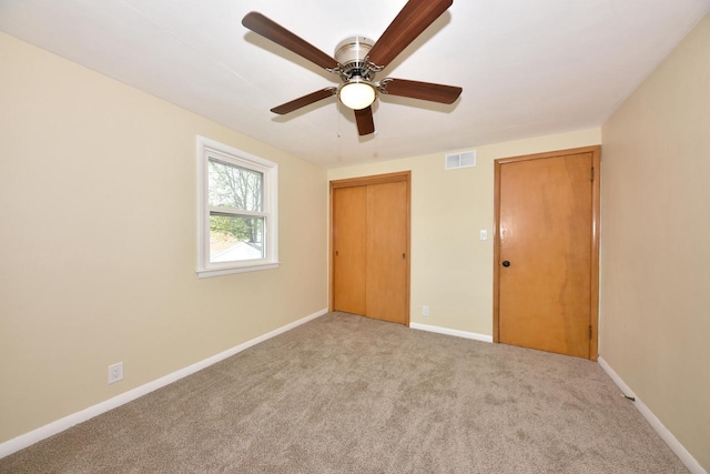 3825 S 5th St Unit 3823, Milwaukee, WI 53207 - unfurnished bedroom featuring carpet floors, baseboards, a closet, and ceiling fan