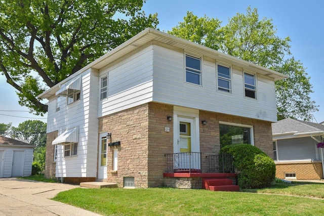 3825 S 5th St Unit 3823, Milwaukee, WI 53207 - view of front of house featuring a front lawn, stone siding, and an outdoor structure