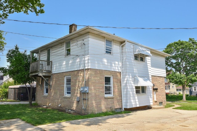 3825 S 5th St Unit 3823, Milwaukee, WI 53207 - view of property exterior with a chimney and a balcony