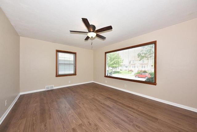 3825 S 5th St Unit 3823, Milwaukee, WI 53207 - empty room featuring a ceiling fan, dark wood finished floors, and baseboards