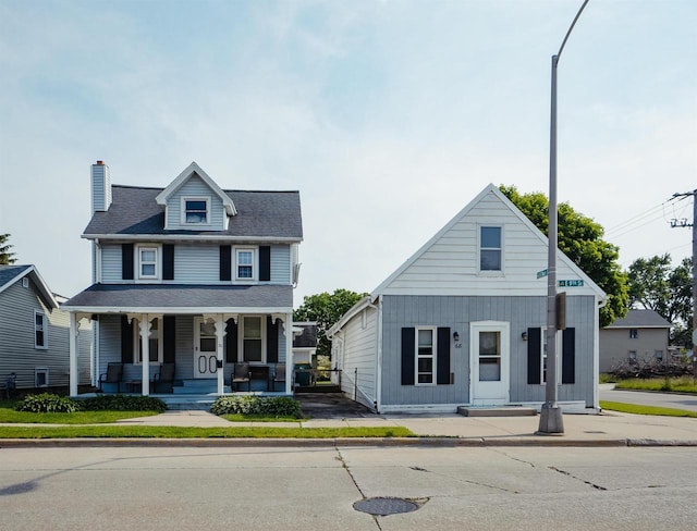 68 E 9th St, Fond Du Lac, WI 54935 - view of front of home with covered porch and a chimney