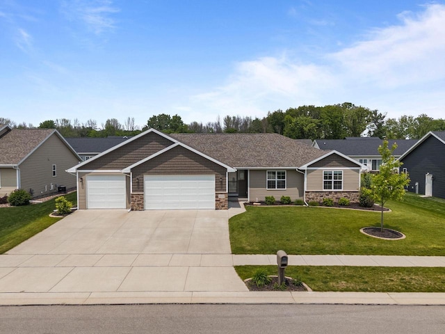W6008 Zach St, Menasha, WI 54952 - craftsman inspired home featuring stone siding, an attached garage, concrete driveway, and a front lawn