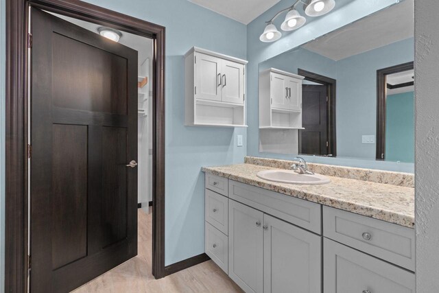 W6008 Zach St, Menasha, WI 54952 - bathroom with vanity and baseboards
