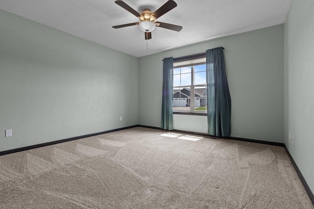 W6008 Zach St, Menasha, WI 54952 - unfurnished room with carpet floors, a ceiling fan, and baseboards