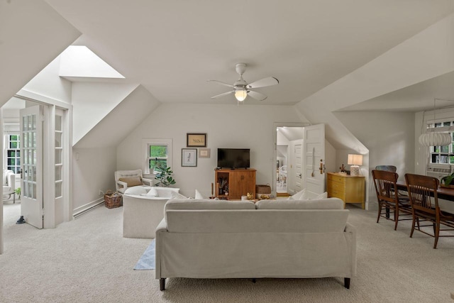 2937 N Mill Rd, Oconomowoc, WI 53066 - living area featuring carpet, ceiling fan, lofted ceiling, and a baseboard radiator