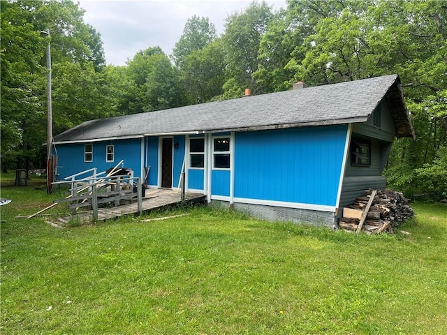 7968 County Road F, Danbury, WI 54830 - rear view of property featuring a yard, roof with shingles, and a forest view