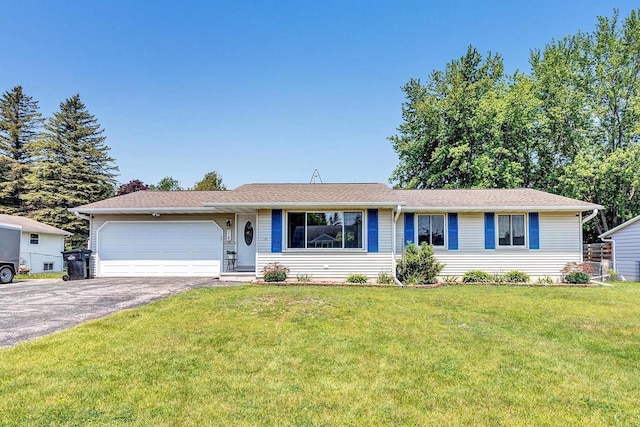 718 Fathom Pl, Sturgeon Bay, WI 54235 - ranch-style house featuring asphalt driveway, a garage, and a front lawn