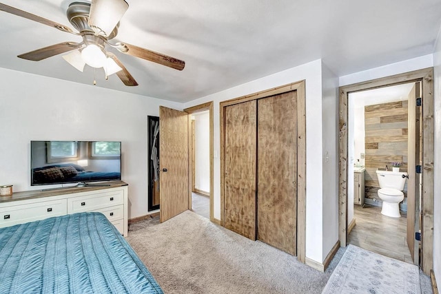 718 Fathom Pl, Sturgeon Bay, WI 54235 - bedroom with baseboards, a closet, a ceiling fan, and light carpet