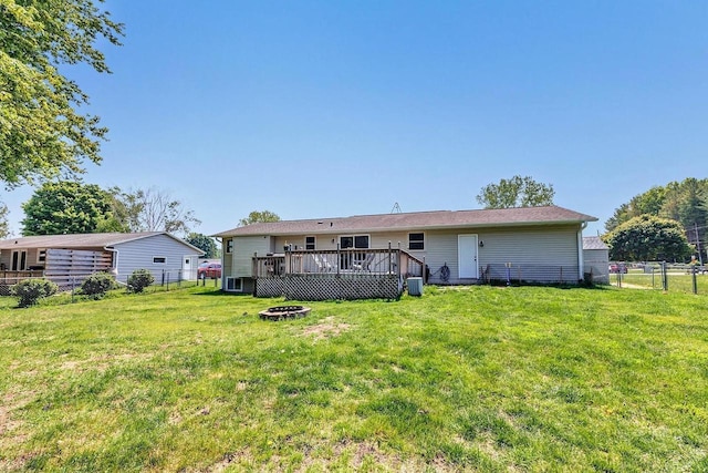 718 Fathom Pl, Sturgeon Bay, WI 54235 - back of house with a fire pit, a wooden deck, and central AC unit