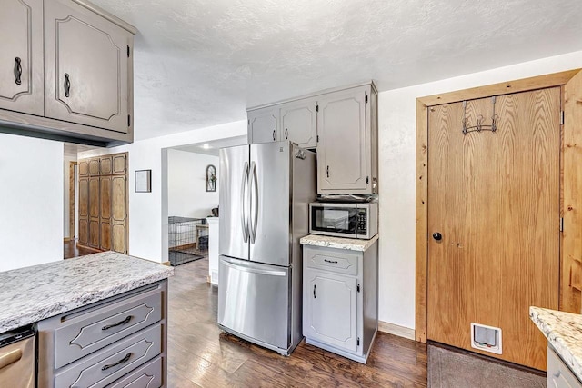 718 Fathom Pl, Sturgeon Bay, WI 54235 - kitchen featuring appliances with stainless steel finishes, gray cabinetry, and dark wood-type flooring